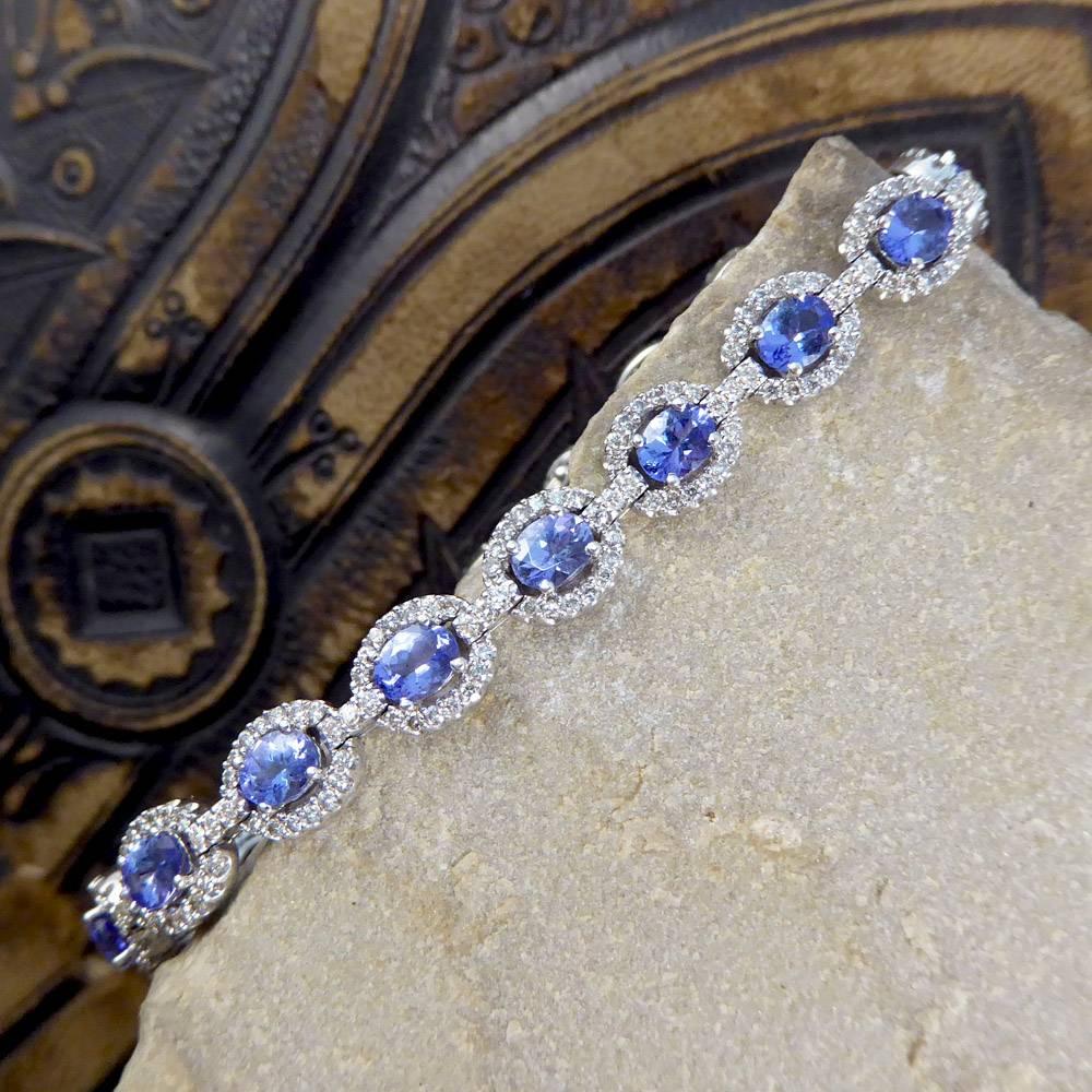 This pretty 14ct white gold bracelet features eighteen mesmerizing tanzanite stones surrounded by diamonds totaling 2.2ct.

 It sits elegantly on the wrist and shines from every angle!

Condition: Very Good, slightest signs of wear due to age and