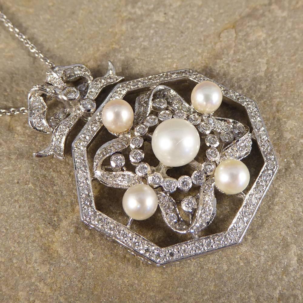 Dare to dazzle with this glamorous contemporary pendant necklace. Set in 18ct white gold it features five central pearls surrounded by diamonds. 

A standout design that is sure to get you noticed!

Condition: Very Good, slightest signs of wear due