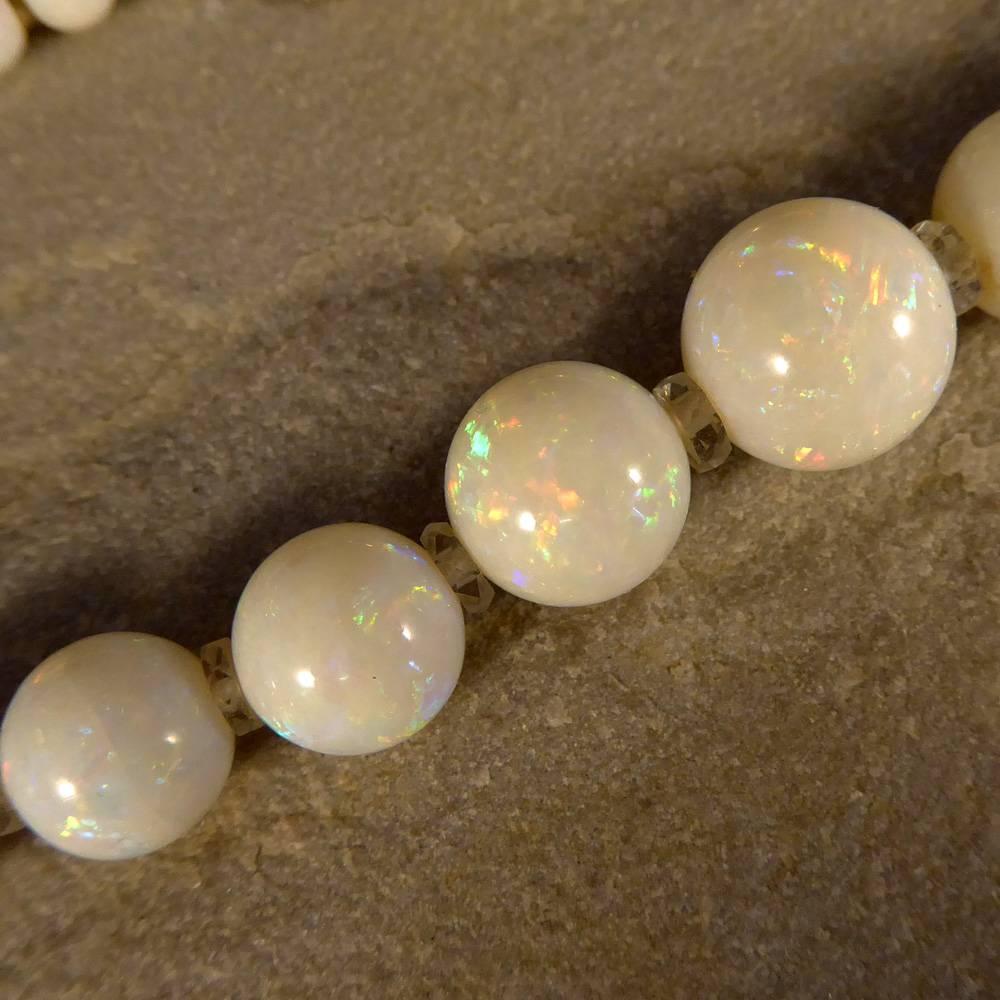 Absolutely stunning Edwardian Opal Beaded Necklace, composed of 82 individual Opal beads with glass spacers, ranging in size from approx 4mm diameter to 11mm diameter. These graduating beads display a shimmering colour profile of pastel blue and