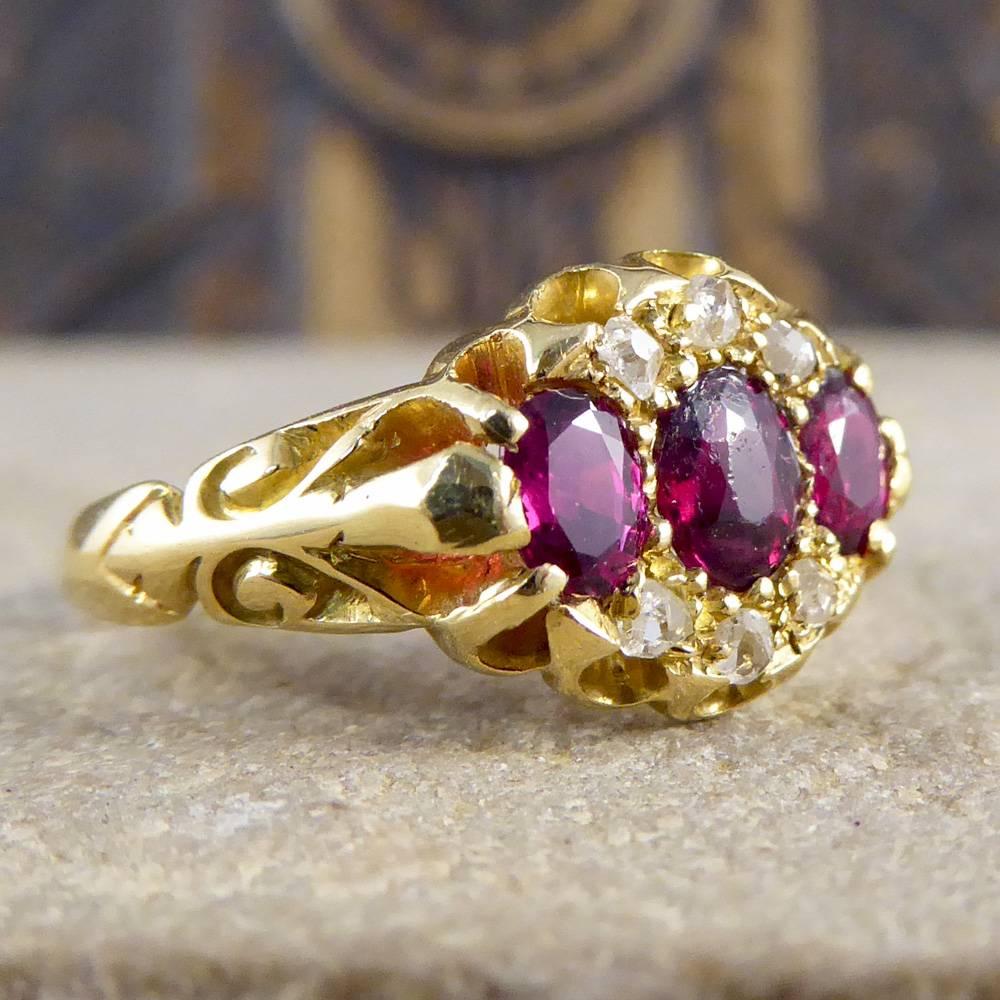 This antique ring was crafted in 1904 in England. It features three garnets surrounded by six diamonds. It has a truly wonderful gallery and shoulder design and is set in 18ct yellow gold!

Ring Size: UK J 1/2 or US 5

Condition: Very Good,