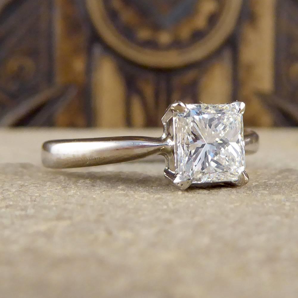 This gorgeous solitaire engagement ring dazzles on the hand!
It features a beautiful princess cut diamond of approximately 1ct modeled on an 18ct white gold band. 

Diamond Details:
Cut - Princess
Colour - H / I
Clarity - VVS2 - VS1
Carat -