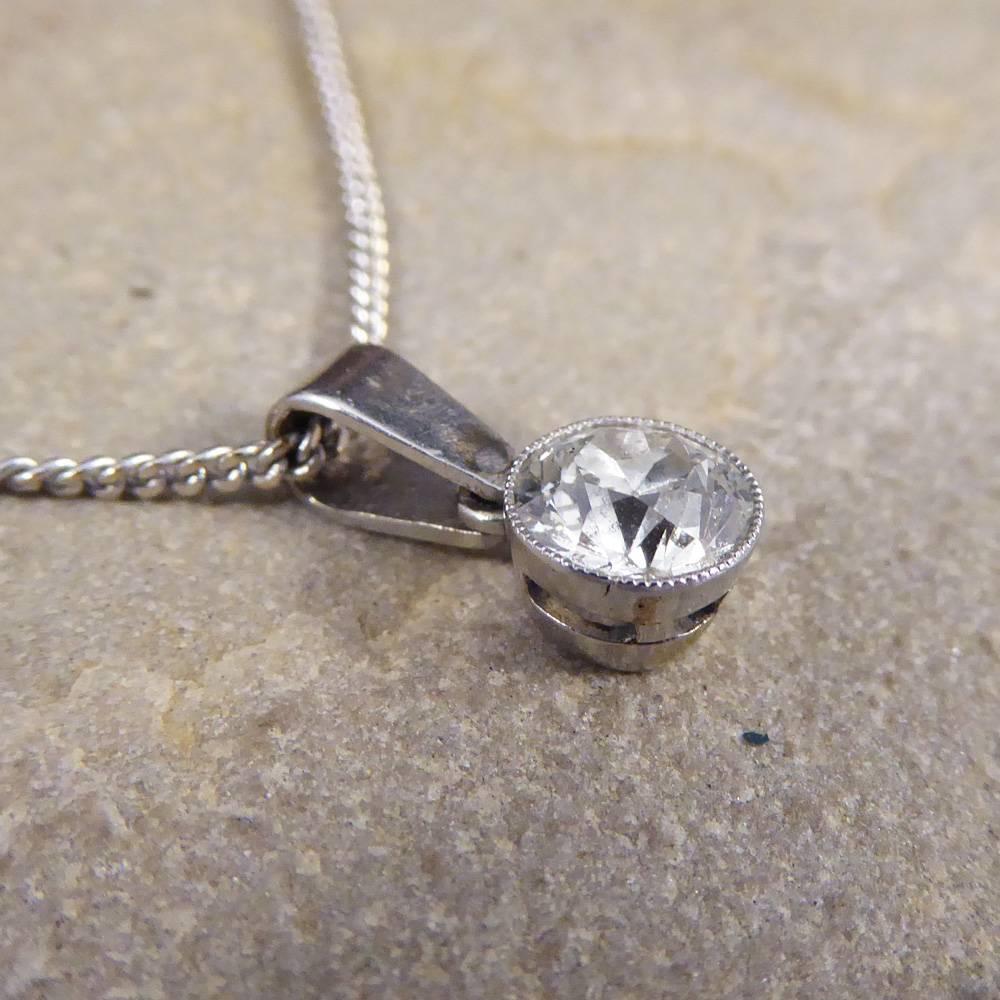 Hanging on a Contemporary 18ct White Gold Chain, sits a beautiful Art Deco Diamond pendant. So elegant and dainty the Diamond weighs 0.85cts the perfect size to be worn everyday or adding some sparkle to any dress. 

Centre Diamond Details:
Cut: Old