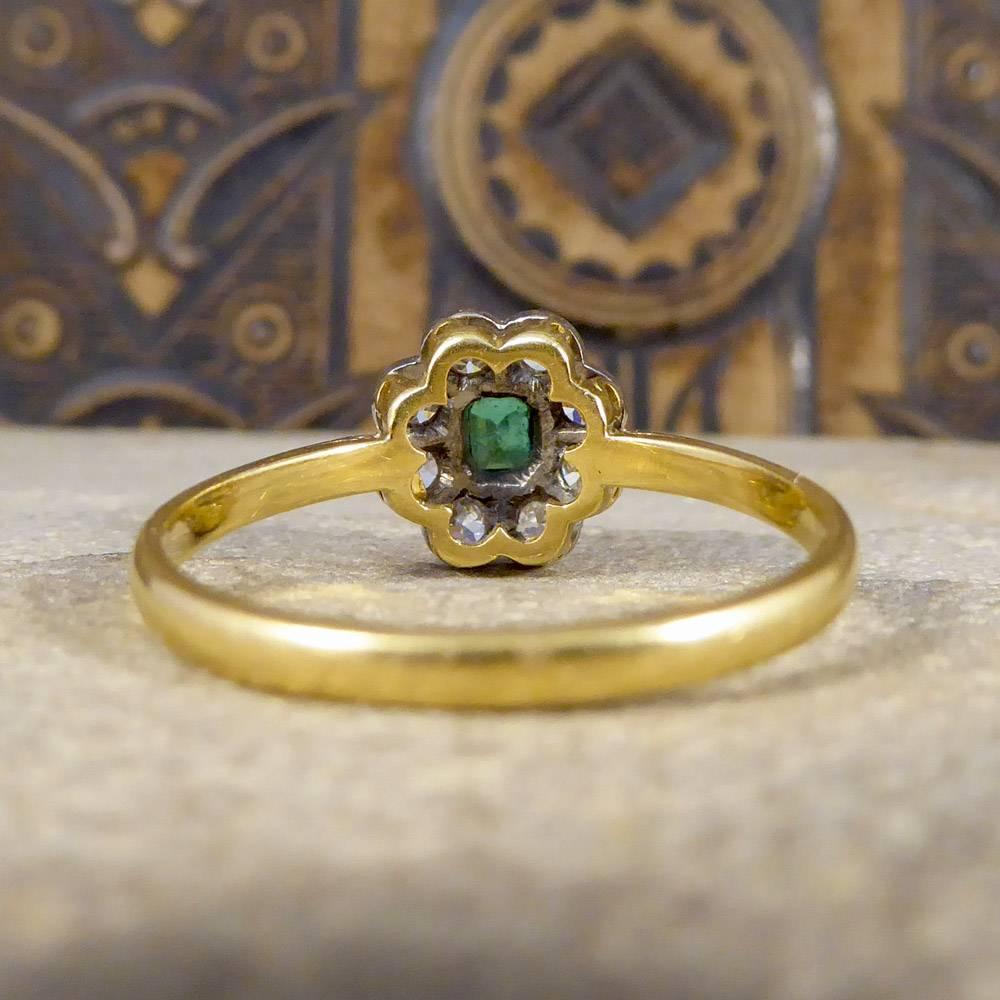 Round Cut Emerald and Diamond Cluster Ring in Platinum and 18 Carat Gold, circa 1930s