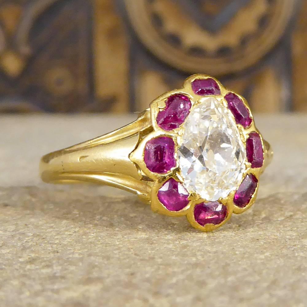Featuring a stunning 1.15ct Old Pear Cut Diamond and surround by 8 Rubies, this ring is a real showstopper and beautiful example of an Antique ring. It was hand crafted in the Late Victorian Era and would be the perfect gift for an Antique