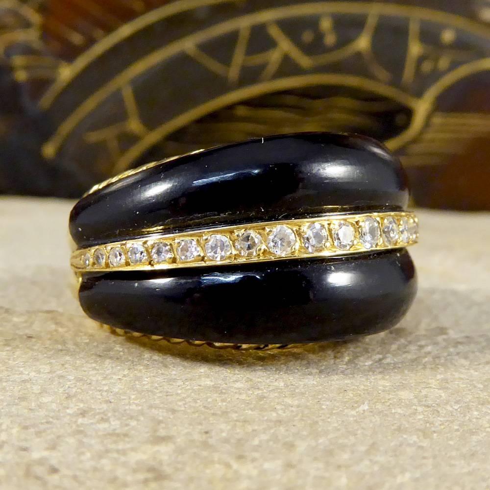 This Vintage ring is large in both size and weight. It would make the perfect stand out statement ring created from Black Onyx with a line of small Diamonds running through the centre, and is set in 18ct Yellow Gold.

Diamond Details:
Carat: 0.20ct