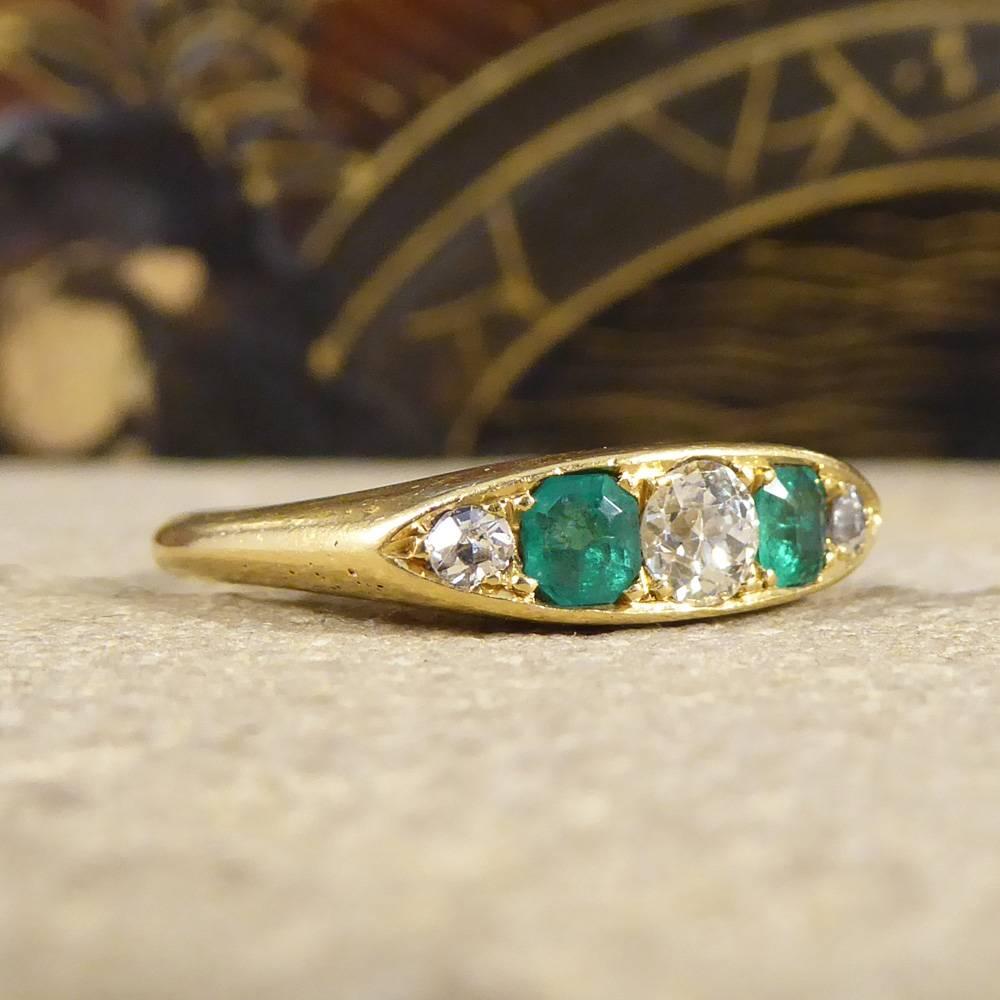 This beautiful ring is a classic example of a Late Victorian style. Featuring two Emeralds and three Diamonds this stunning five stone ring is setin 18ct Yellow Gold, and would make the perfect gift for any antique lover.

Ring Size: UK J or US