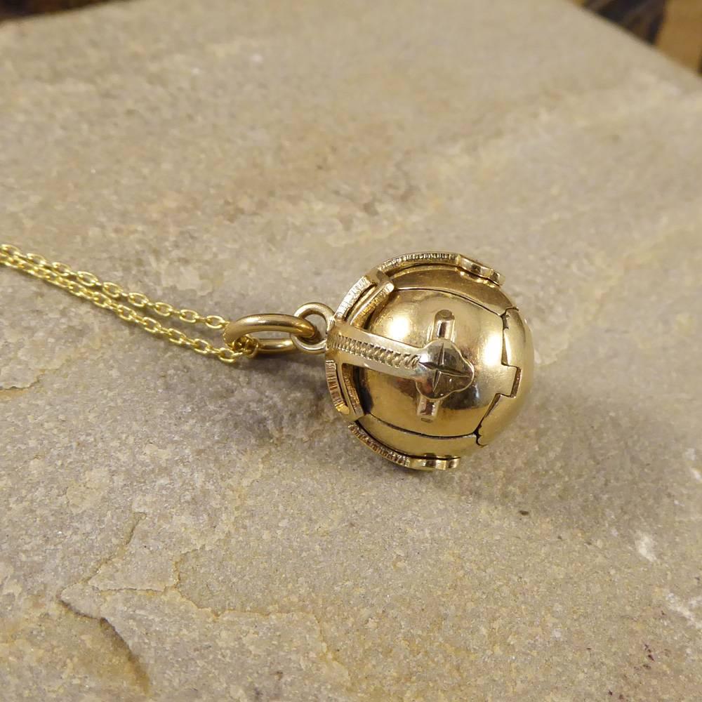 This great Silver and 9ct Gold Vintage English Masonic Orb opens to reveal 6 expertly hand-engraved equally-sized pyramids. When open the orb transforms into a cross. Each pyramid is held to its neighbour by secure hinges, when folded back into a