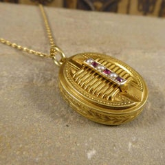 Antique Victorian Pearl Garnet Pendant Locket on a 15 Carat Gold Chain