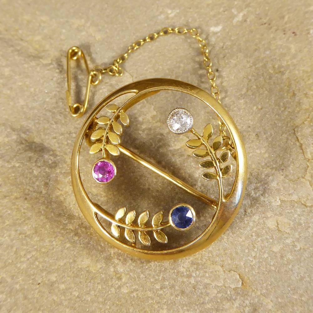 In the Edwardian era, society was at the height of its elegance and sophistication, which was projected into their jewellery. This pretty Edwardian brooch features three single gems, one Sapphire, one Ruby and one Diamond. Created in 15ct Gold, this