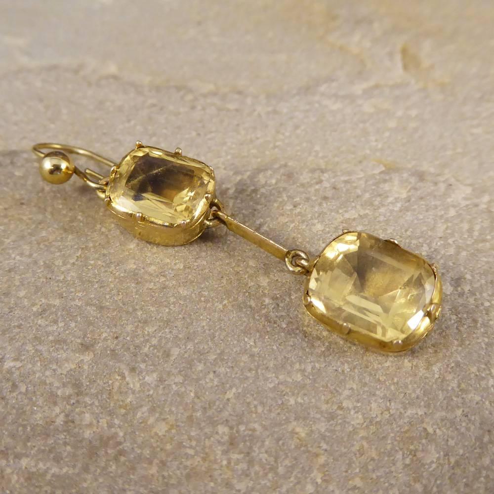 A classic set of Mid Victorian Earrings tested as 9ct yellow gold, set with two Citrine gemstones in each earring. Previously created as a necklace, this piece has been converted into gorgeous Earrings. Showing a closed back on the top citrine and