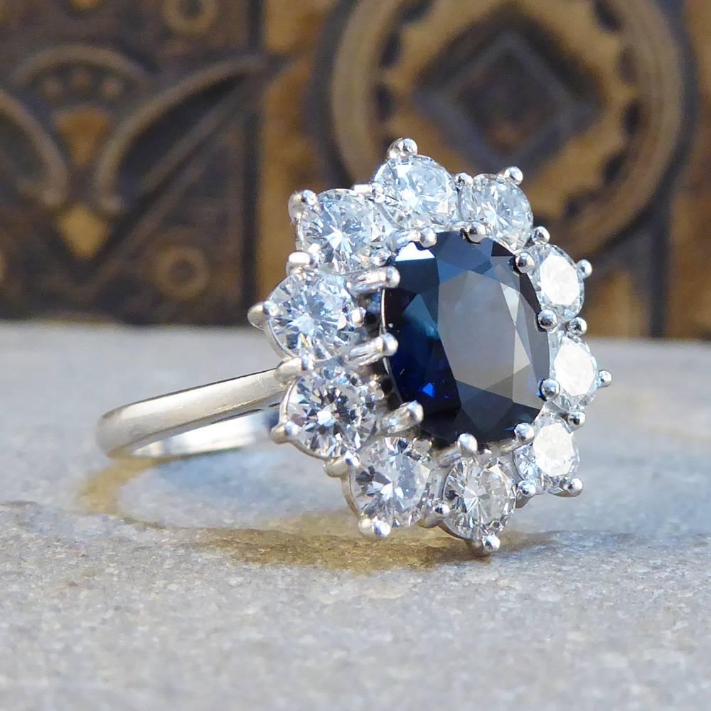 Dare to dazzle with this magnificent contemporary cluster ring. Set with a 2.14ct centre sapphire surrounded by ten diamonds totalling 1.15ct total weight, it truly sparkles on the finger!

It has been set in 18ct white gold and would make a