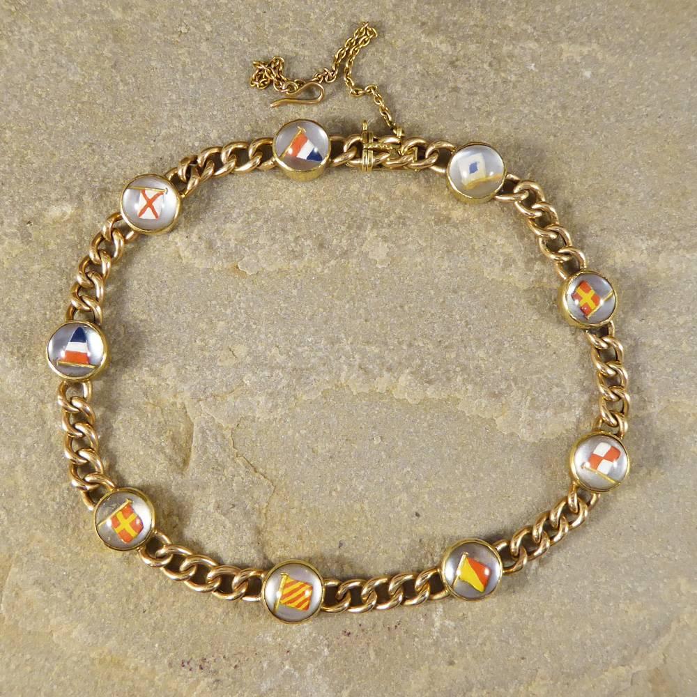This bracelet uses a signalling system called Semaphore which uses the position of the flags relative to a person to denote the letter which is International code flags. It has been crafted in the Edwardian era in 15ct Yellow Gold spelling out the