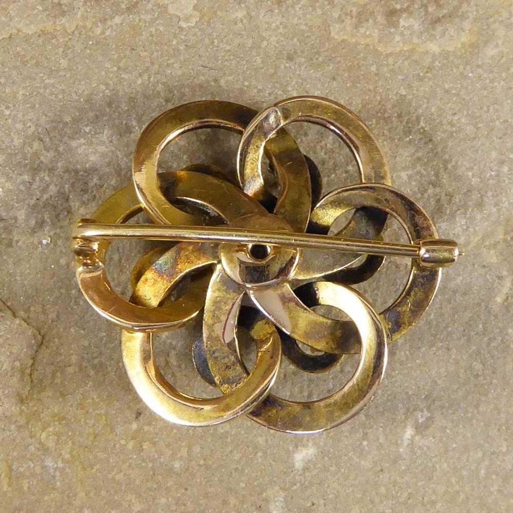 Such a beautiful Late Victorian brooch crafted from 15ct Yellow Gold with blue enamel detailing of flowers. Adorning this brooch are 6 Diamonds and one slightly larger one in the middle weighing approx 0.55ct in total. Was once a Pendant/Brooch with
