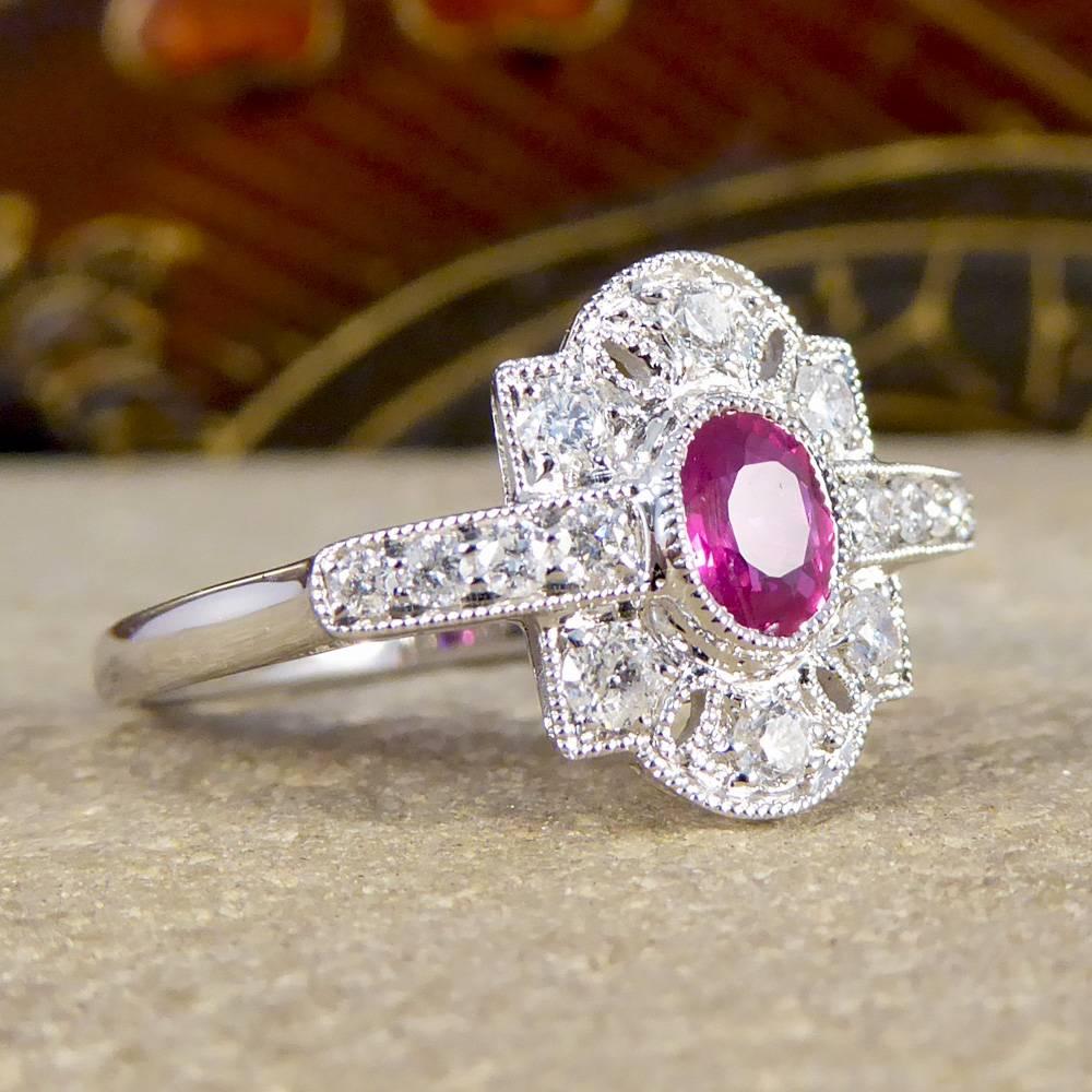 This exquisite Contemporary ring has been designed to reflect an Art Deco style, which was a very popular era in jewellery with such a beautiful aesthetic. Set with a single Ruby weighing 0.40ct and a total of 0.30ct of Diamonds in 18ct White Gold