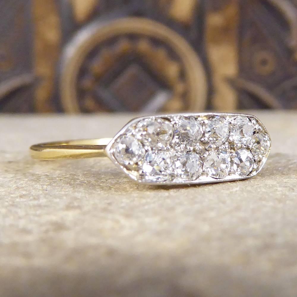 This stunning ring is a perfect example of an elegant Art Deco piece. Featuring eight Old Cut Diamonds in two rows with one Diamond on either side. It has a simplistic beautiful setting and gallery, and has been hand crafted from 18ct Yellow