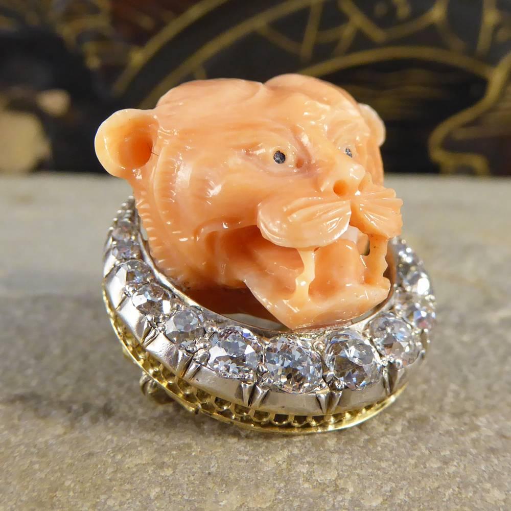 This unique Late Victorian brooch features a panthers head crafted in coral sat on a crescent of diamonds.

Set in 15ct Gold and Silver it is a truly fascinating find for any collector / wearer of antique jewellery!

Condition: Very Good, slightest