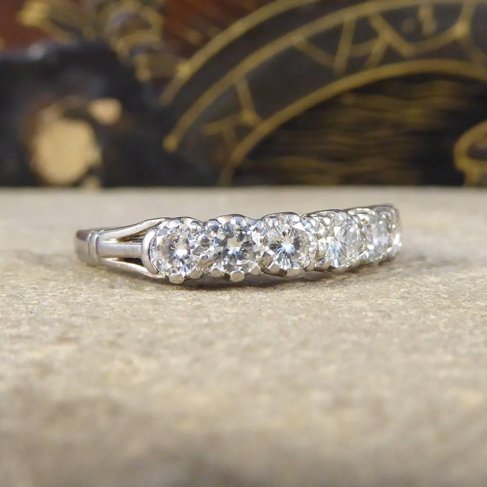 This beautiful seven stone Diamond ring has been set 18ct white gold. Featuring a level row of Diamonds all of the same size, totaling 0.78ct sat on stylishly formed shoulders. It dazzles and sparkles on the finger with well matched clear and bright