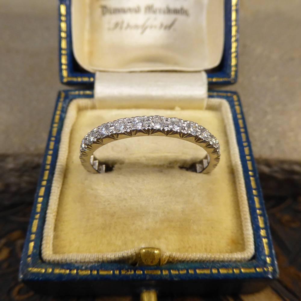 This contemporary eternity ring has been set with 28 modern brilliant cut Diamonds weighing 0.84cts in total. With it sparkling from every angle, this ring would make the perfect wedding band, eternity ring or stand alone piece. 

Diamond