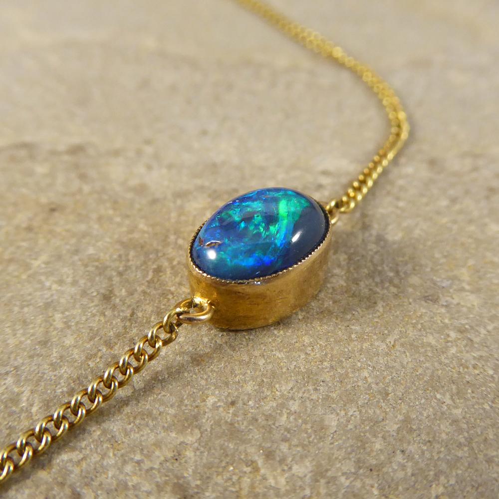 Edwardian Long 15 Carat Yellow Gold Chain Necklace with Four Black Opal Stones In Good Condition In Yorkshire, West Yorkshire