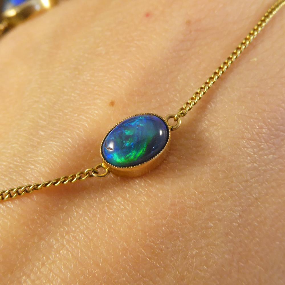 Edwardian Long 15 Carat Yellow Gold Chain Necklace with Four Black Opal Stones 1