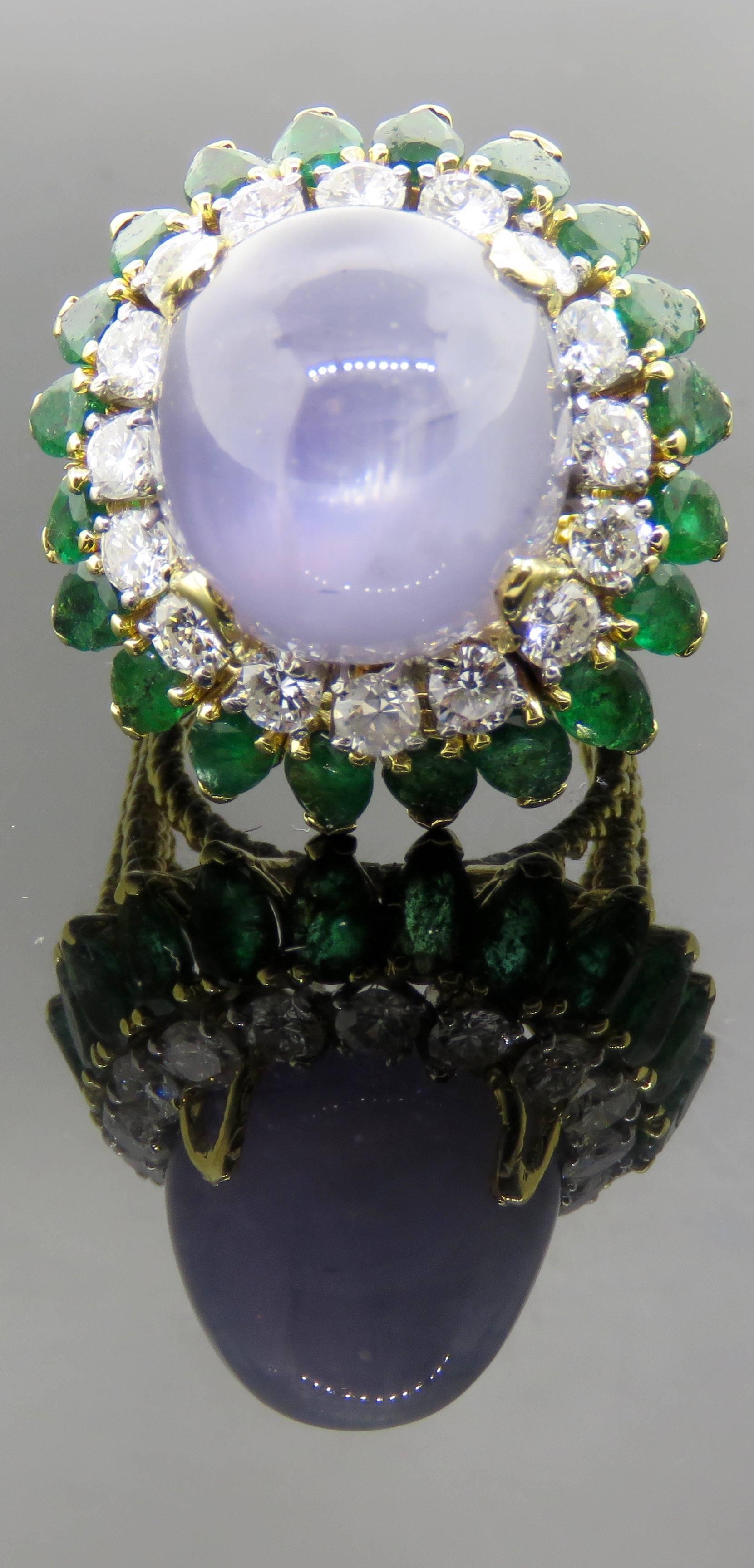 Gorgeous diamond and pear shaped emerald ring on 18K Gold. 
