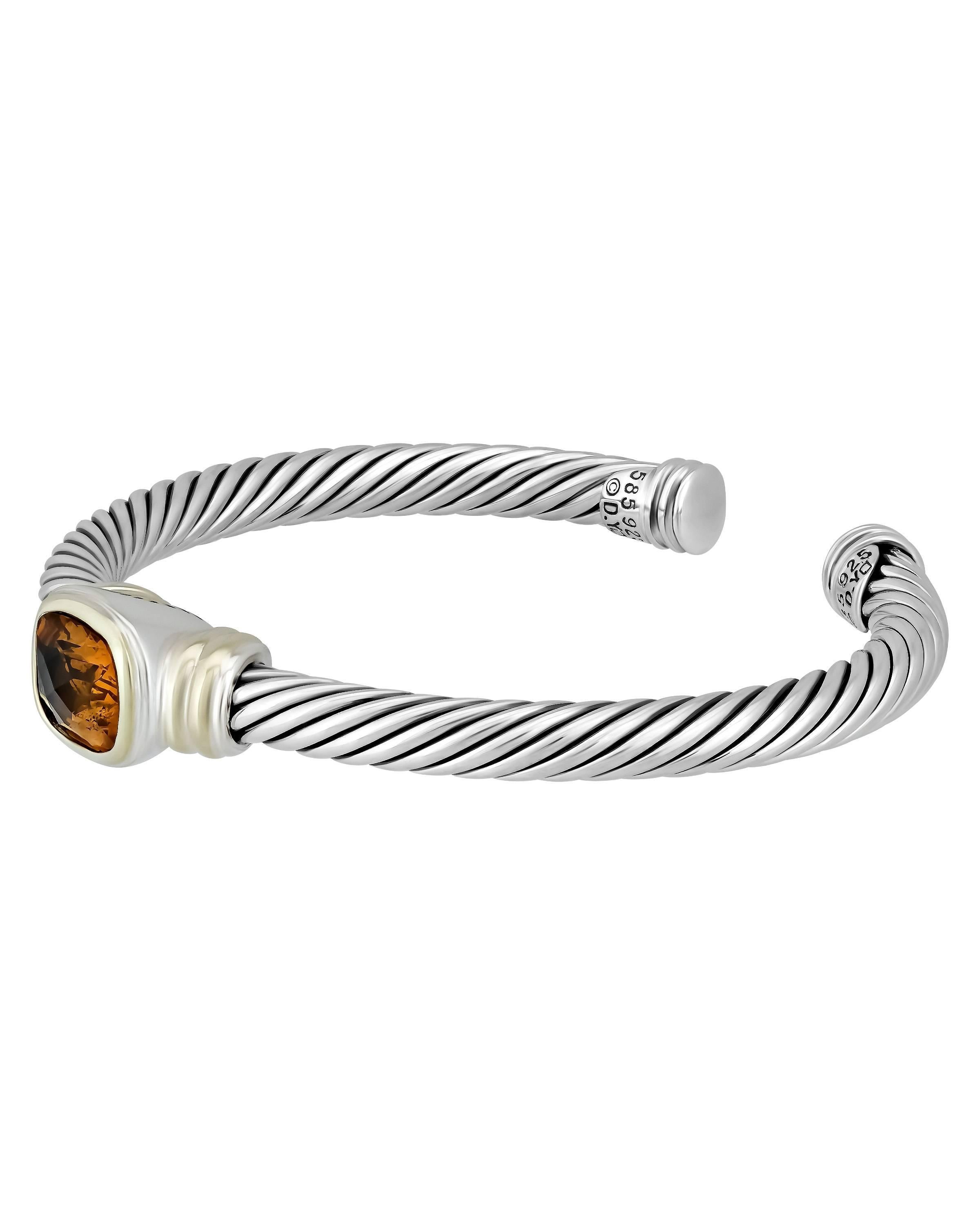 The citrus hue of the faceted citrine on the ends of this cuff bracelet is immediately enchanting, and the sterling silver cable and yellow gold complement it beautifully.

METAL TYPE: 14K Sterling Silver
TOTAL WEIGHT: 31.3g