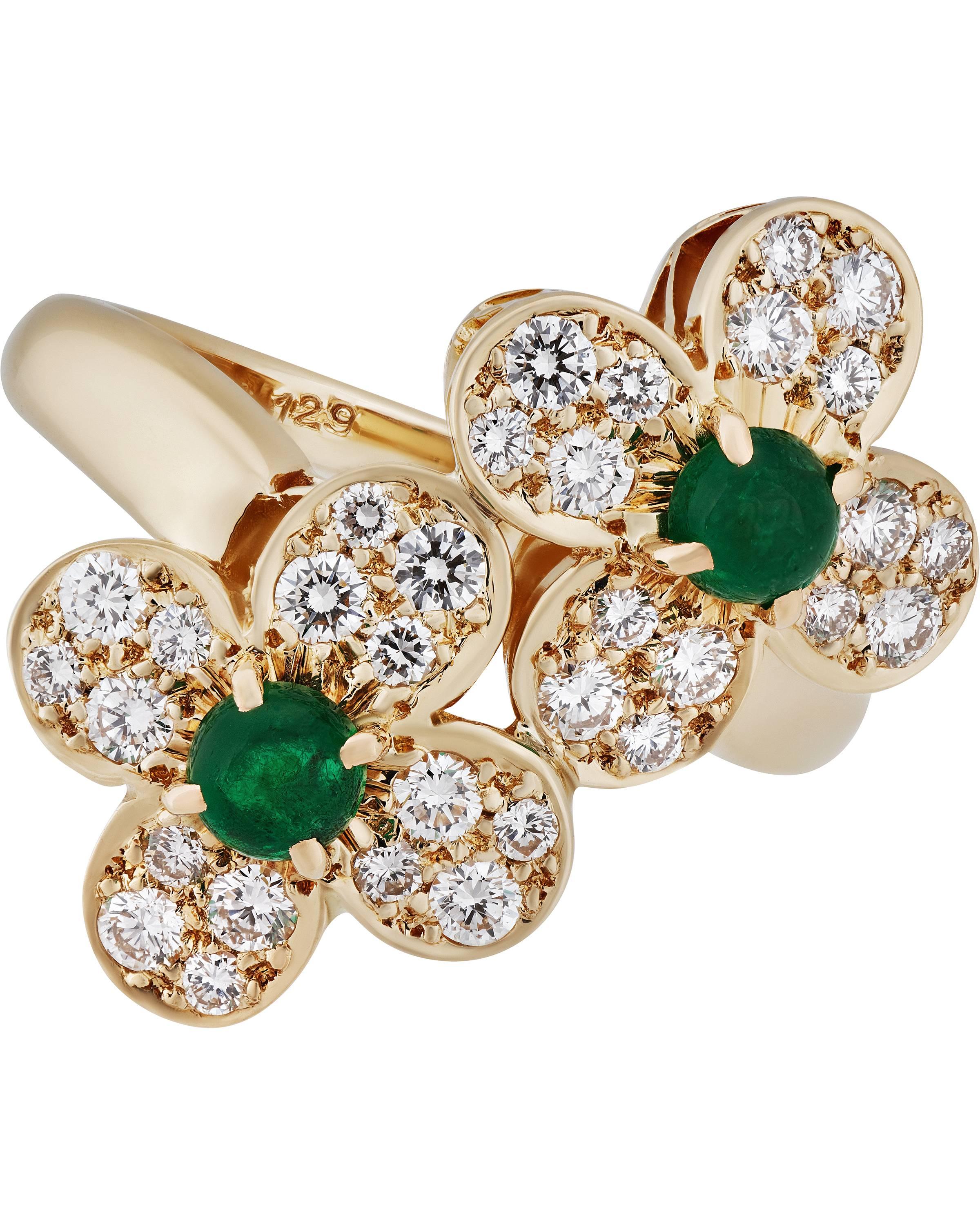 The adorable, stunningly designed pair of floral motifs on this ring are immediate attention-grabbers, particularly thanks to the captivating emeralds.

METAL TYPE: 18K Yellow Gold
STONE WEIGHT: 0.64ct twd
TOTAL WEIGHT: 6.9g
RING SIZE: