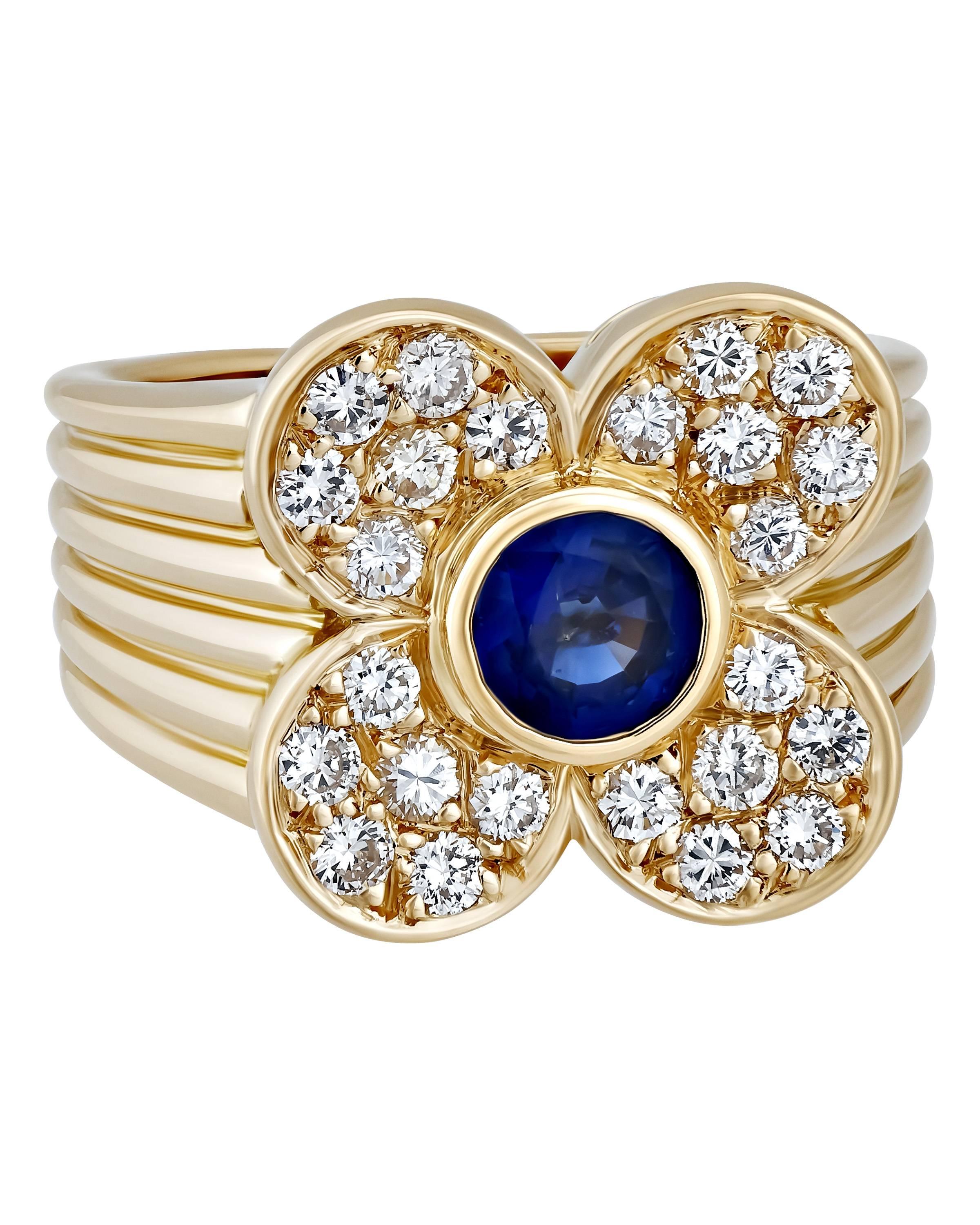 The yellow gold band on this vivid, eye-catching ring perfectly complements the diamond and sapphire. This one piece is evocative of a splendid spring or summer day.

METAL TYPE: 18K Yellow Gold
STONE WEIGHT: 0.75ct twd
TOTAL WEIGHT: 10.0g
RING