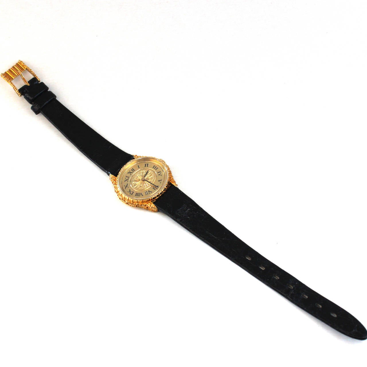 A Buccellati gold watch by Girard Perregaux.

The elegant piece by Gianmaria Buccellati features a Swiss-made Girard-Perregaux watch. It has an 18k yellow gold dial and leather strap ending with a 18k yellow gold buckle. The dial and buckle have