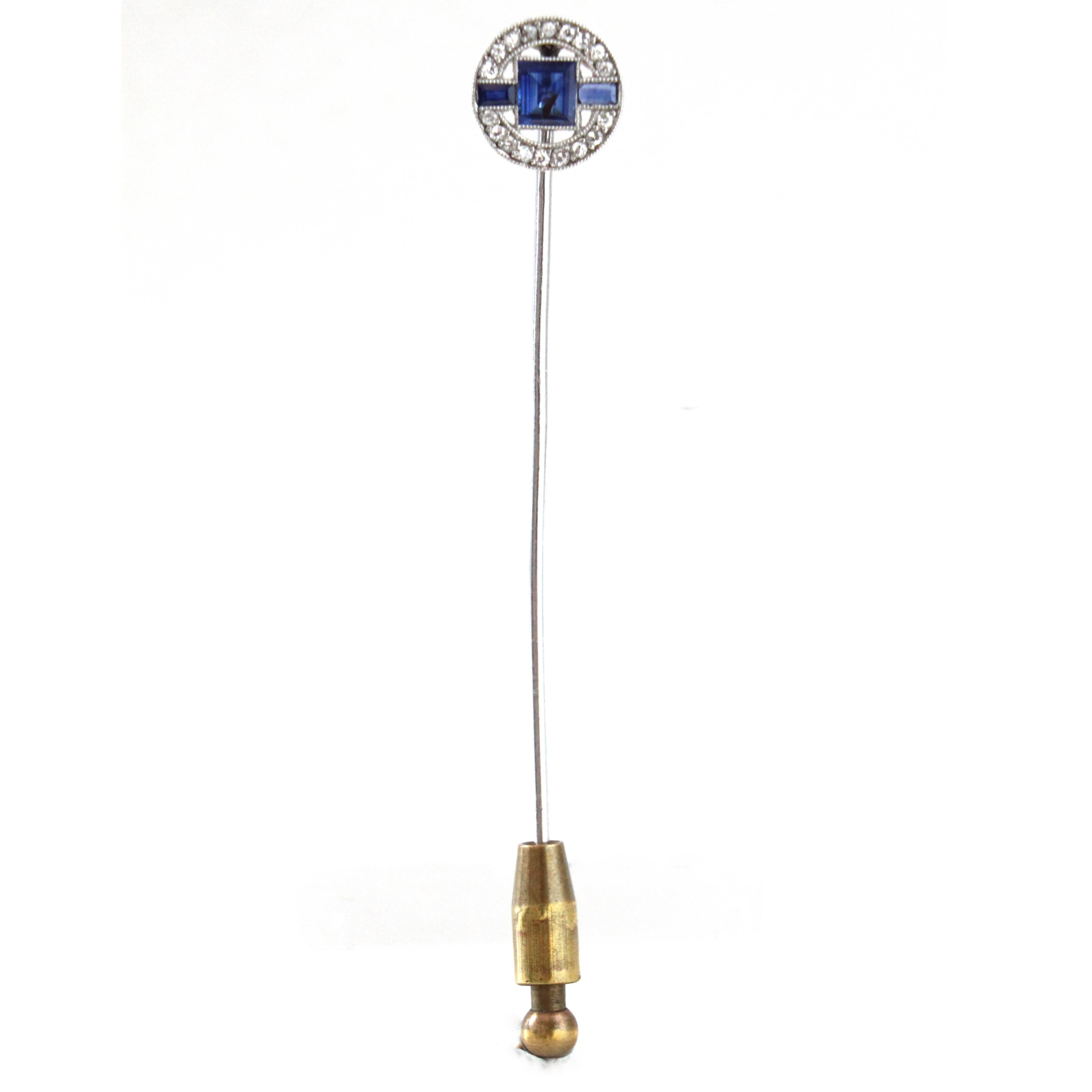 An exquisite Art Deco Sapphire and Diamond Stick Pin, France, ca. 1930s.

The circular head of the pin has in the center a bright rectangular-cut sapphire surrounded by two other sapphires and old-cut diamonds. The piece follows a strong