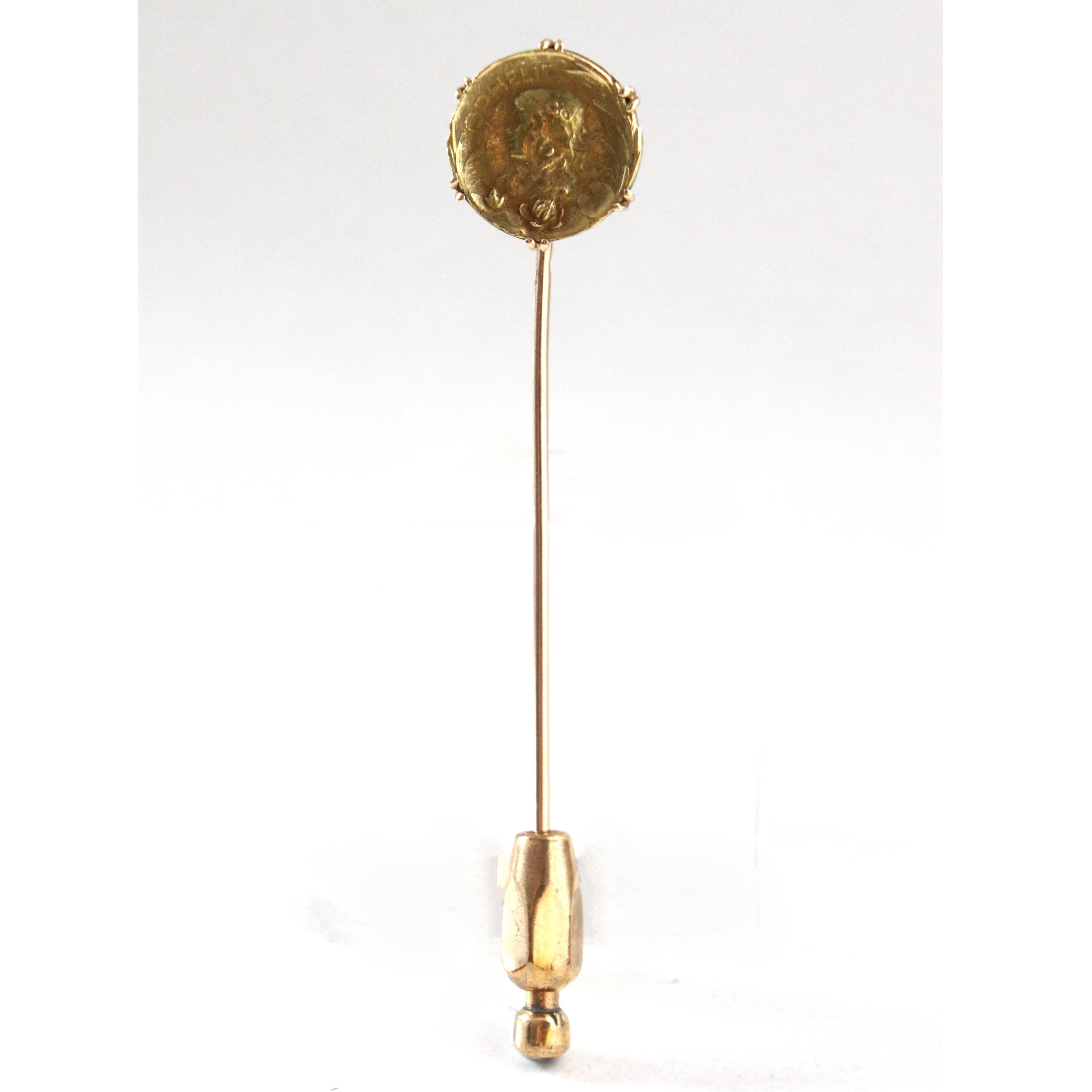 French Art Nouveau Stick Pin, ca. 1910s.

The pin is based on a gold coin depicting William Shakespeare's Hamlet figure 