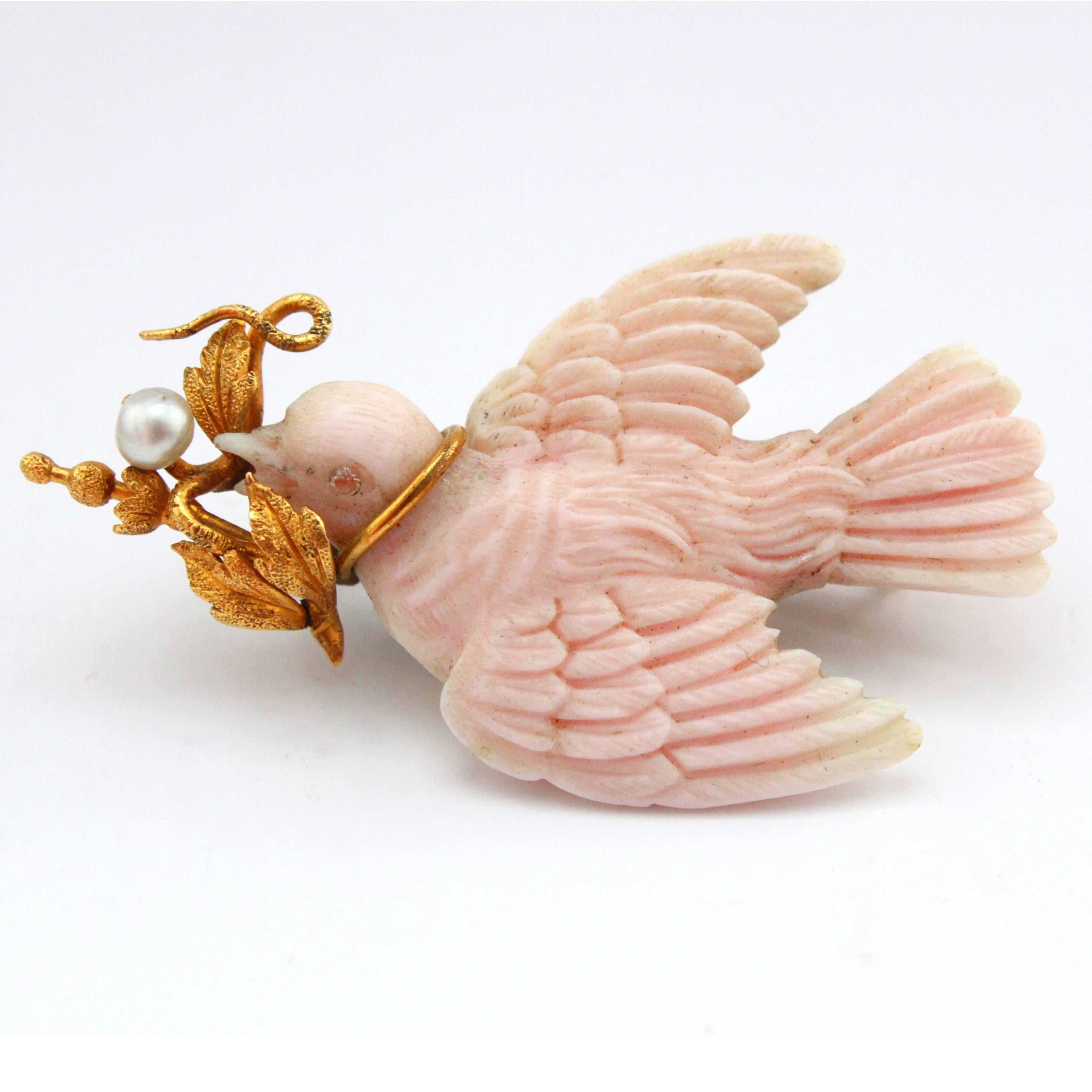 A beautiful carved angel skin coral brooch, depicting a dove with peaceful gold leafs and a pearl, ca. 1890s.

Great for starting peaceful and happy New Years.