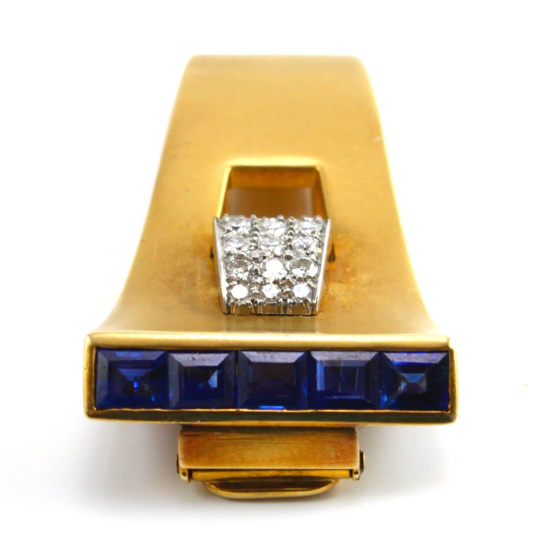A very sleek and elegant Sapphire and Diamond Clip Brooch made in the 1940s, depicting the typical Retro design.

The diamonds weigh circa 1 carats and the sapphires weigh circa 1.5 carats. Both are of excellent quality.
