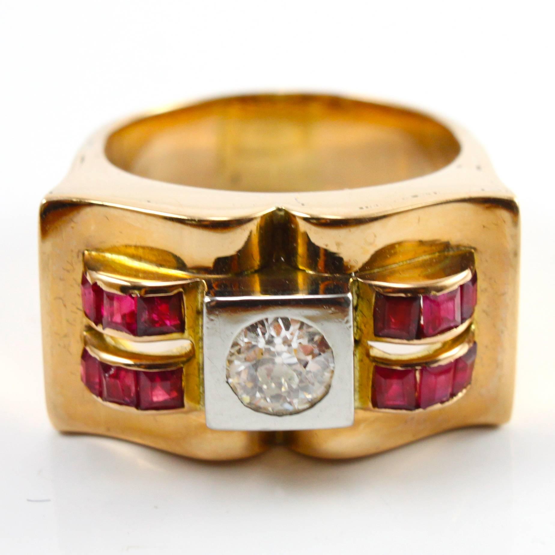 A very chic Retro ruby and diamond ring from the 1940s, centring an old-cut diamond of ca. 0.45 carats and shouldered by ruby baguettes on both sides.
Numbered.

The ring shows distinct abstract and machinist design of the retro period.

Ring size 6