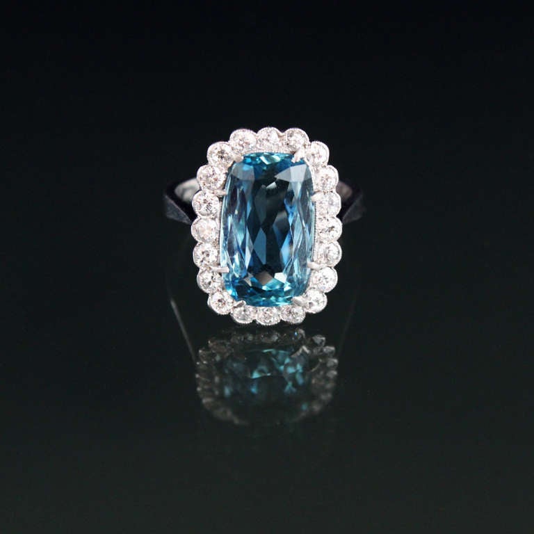 An aquamarine ring, with a very fine Brazilian aquamarine of 6.73 carats from the famed Santa Maria mine, and surrounded by circa 1.3 carats of diamonds.