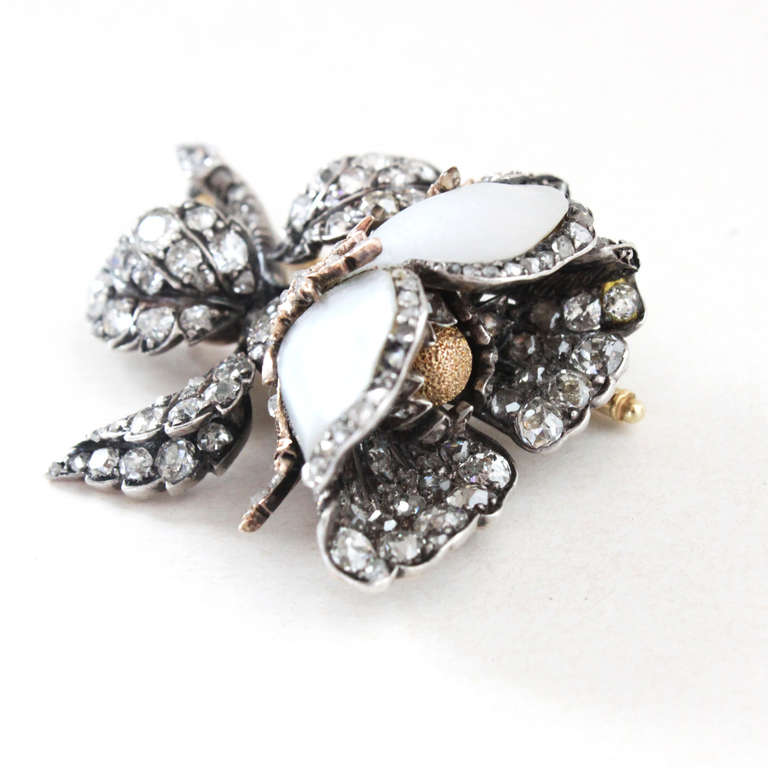 Beautiful and very finely made brooch from the 1890s. Set uniquely with old cut diamonds (circa 4 carats) and mother of pearl petals, in gold and silver.
