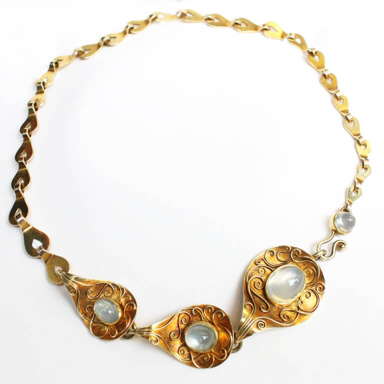 A very chic moonstone and gold necklace by Elisabeth Treskow. The necklace has granular gold carvings around the moonstones in the center, which was one of Treskow's creations and characertistics of her jewellery that she individually created for