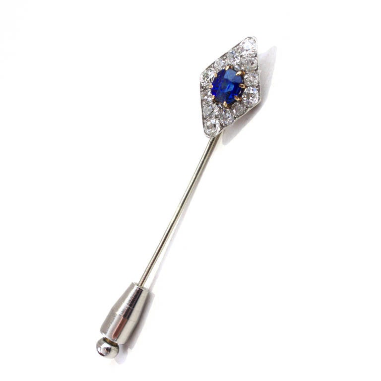 An impressive tie pin in the form of a lozenge from the Art Deco era. There are 12 fine old European cut diamonds, weighing circa 1.2 carats and two small rosecut diamonds. The sapphire is of royal blue colour and weighs circa 1.16 carats.