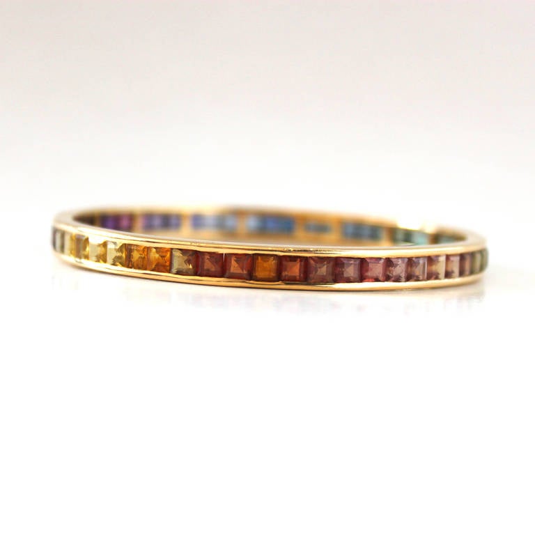 A rainbow bracelet with multicoloured Tourmaline carres in 18k yellow gold, signed and stamped by the Swiss Jeweller Kurz.

The inner diameter is 6.5cm.