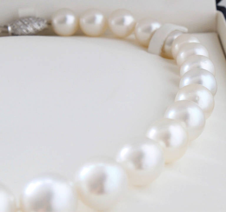 A very pretty pearl necklace with 31 big south sea pearls ranging from 12.3 mm to 17.5 mm. The pearls have a beautiful white colour and display excellent lustre. The secure clasp is in 14k white gold set with brilliant cut diamonds.

The length of