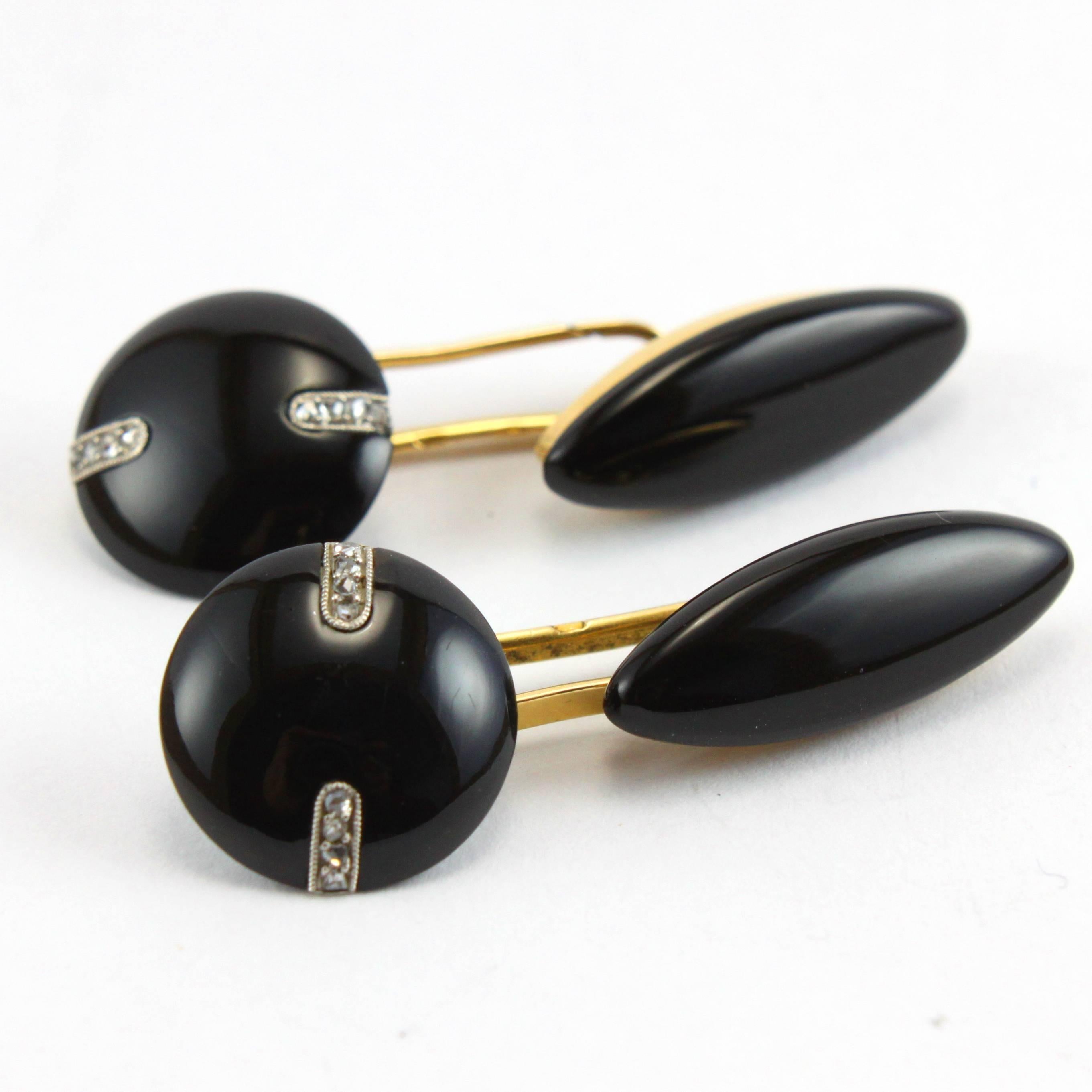 A very elegant pair of Art Deco cufflinks with onyx and rosecut diamonds in 18k yellow gold, French stamp marks.