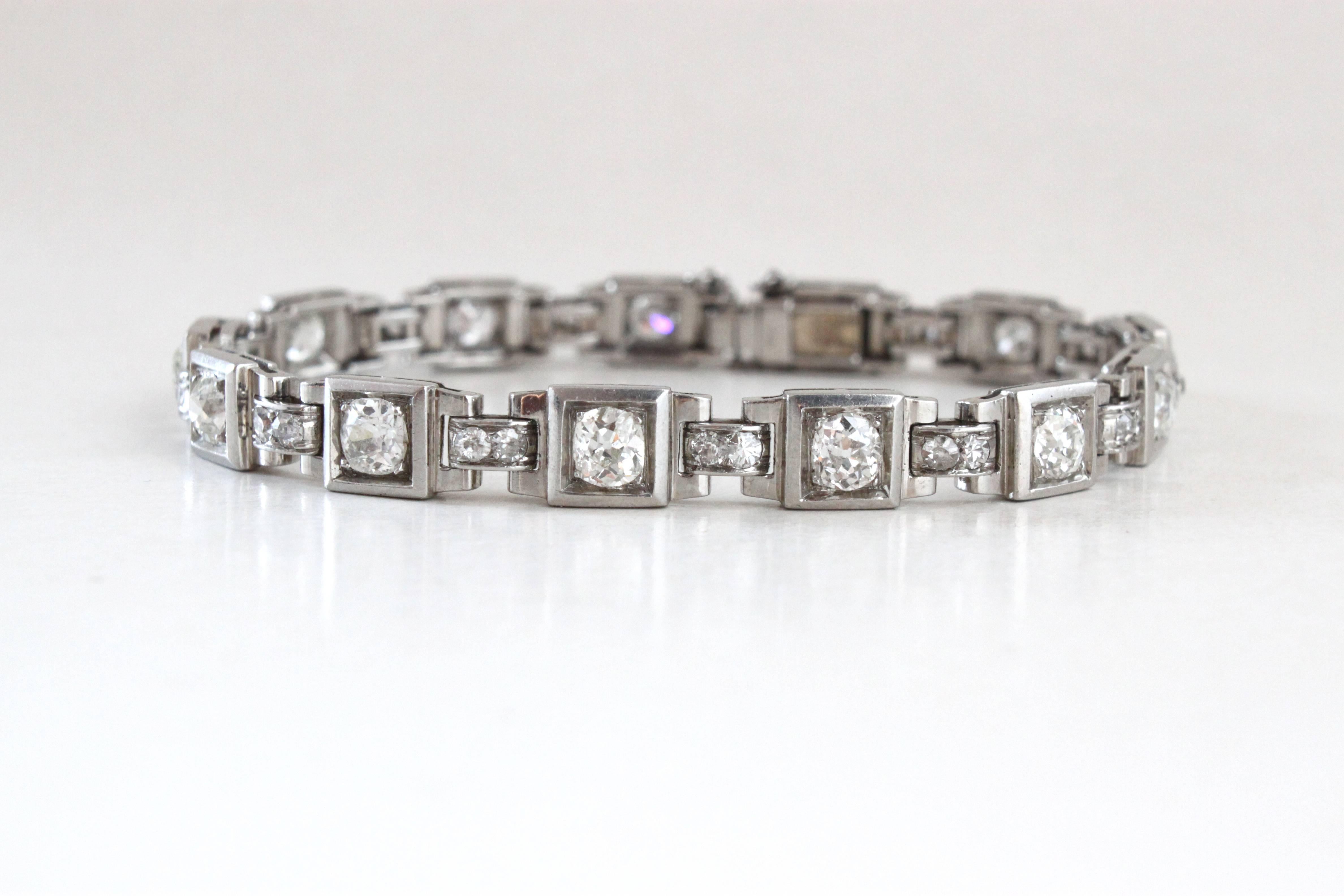 A beautiful French Art Deco Platinum Diamond Bracelet, ca. 1930s.

The geometric designs consists of 13 platinum links set with old-cut cushion diamonds (ca. 6 carats) and made beautifully in platinum.

French hallmarks and indistinct maker's