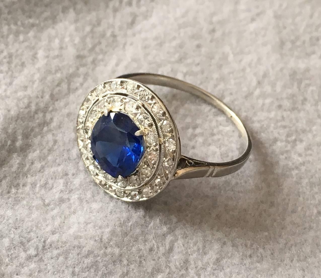A wonderful Edwardian ring with a rare natural unheated Burma sapphire in the centre. The sapphire is a round brilliant cut stone and has a deep blue colour with a beautiful crystal. It comes with a certificate from the Swiss gem lab SSEF, stating