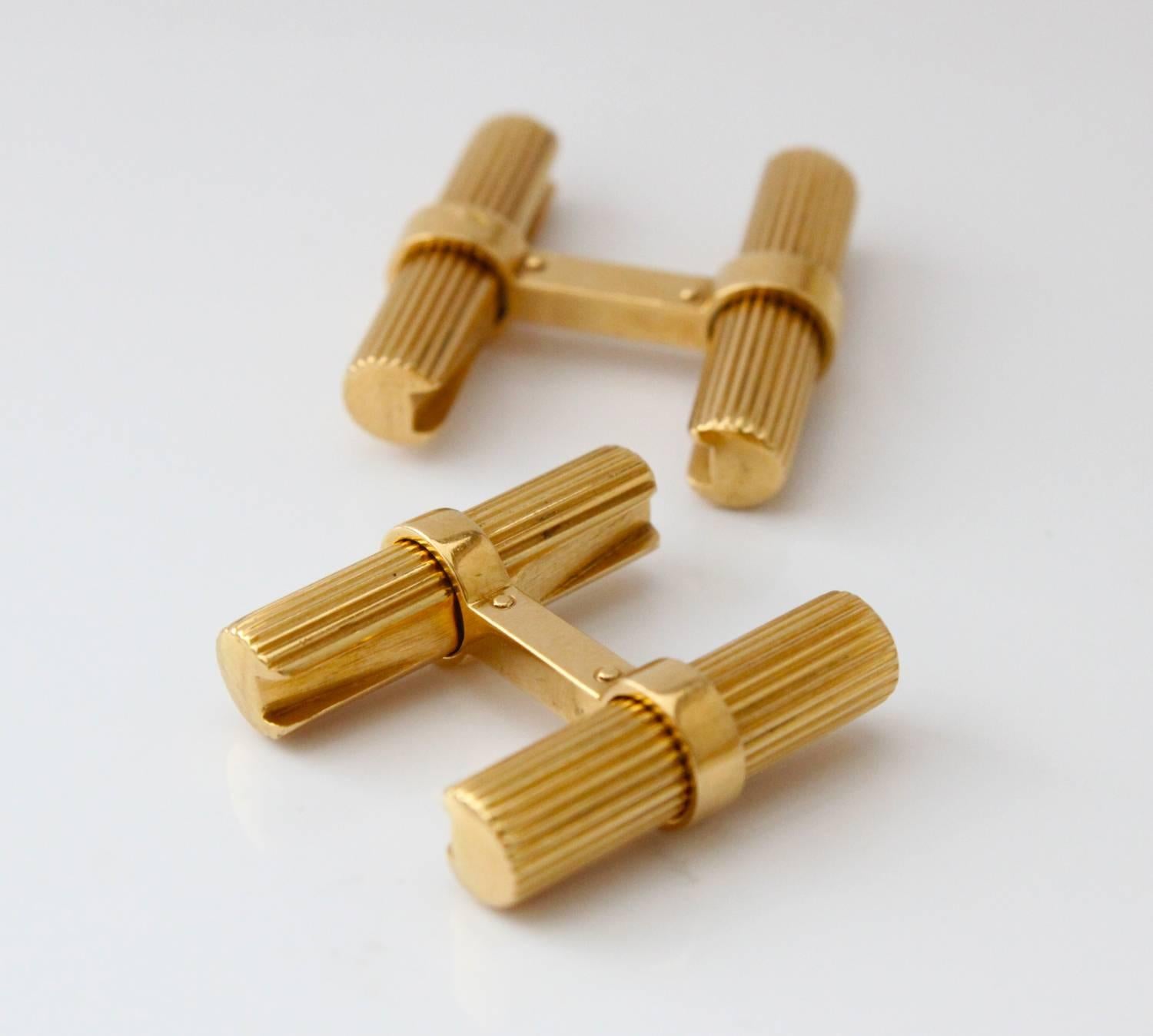 These very popular cufflinks in 18k yellow gold are timeless beautiful and very easy to wear. The gold sticks slide out with a simple twist. They can also be interchanged with other sticks that are made out of differently coloured gemstones or metal