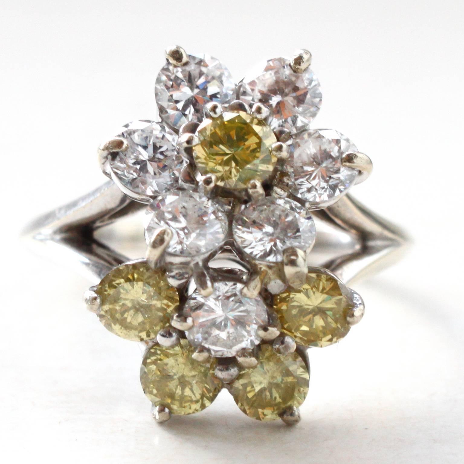 A very chic Fancy-coloured Yellow and White Diamond Cocktail Ring, by Mauboussin Paris.

The diamonds are arranged as two flowers and weigh circa 3 carats. The yellow diamonds are of intense color and the white diamonds are of D-F color. 

The ring