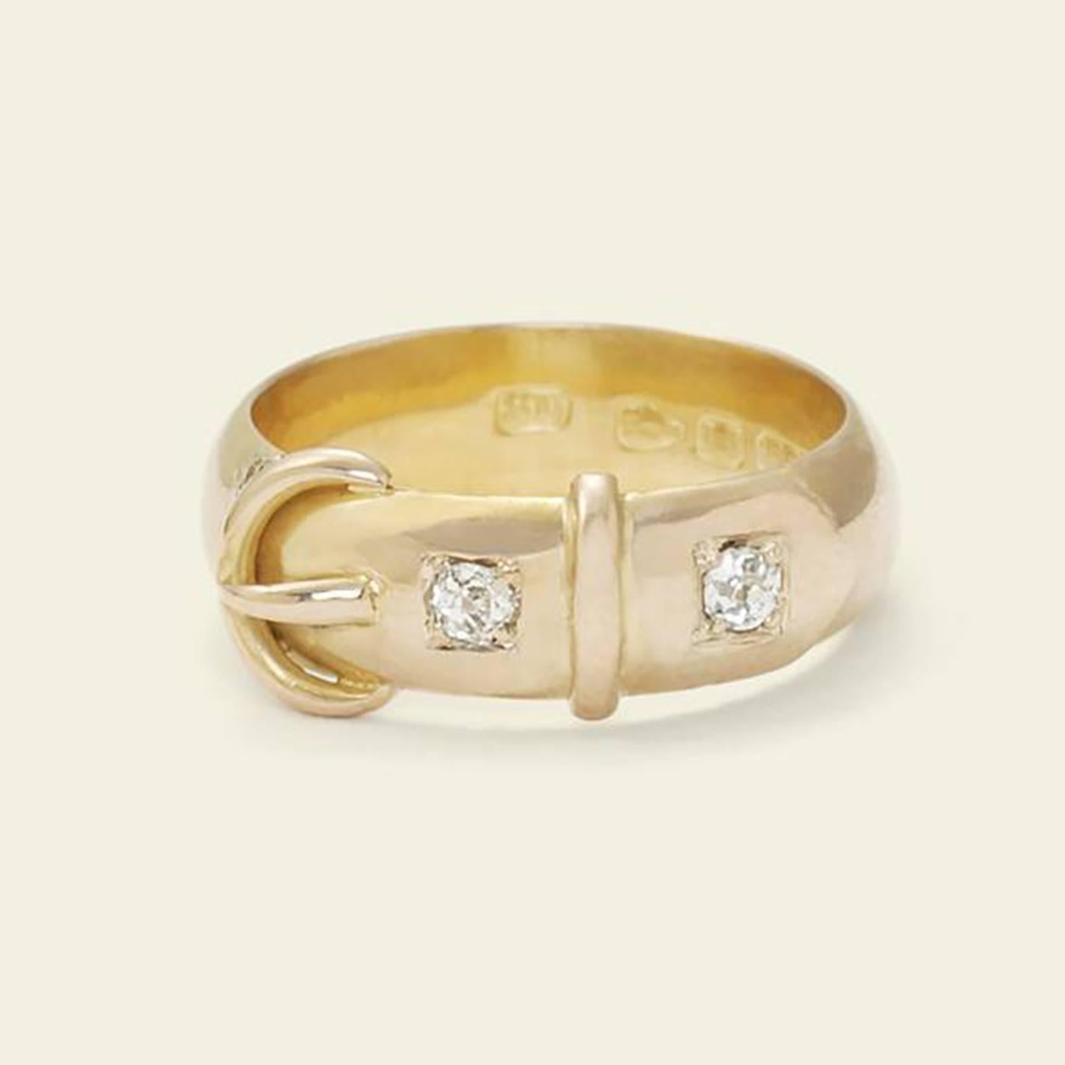 This fantastic Victorian novelty ring features a hinged belt motif panel at the face which opens to reveal the word 