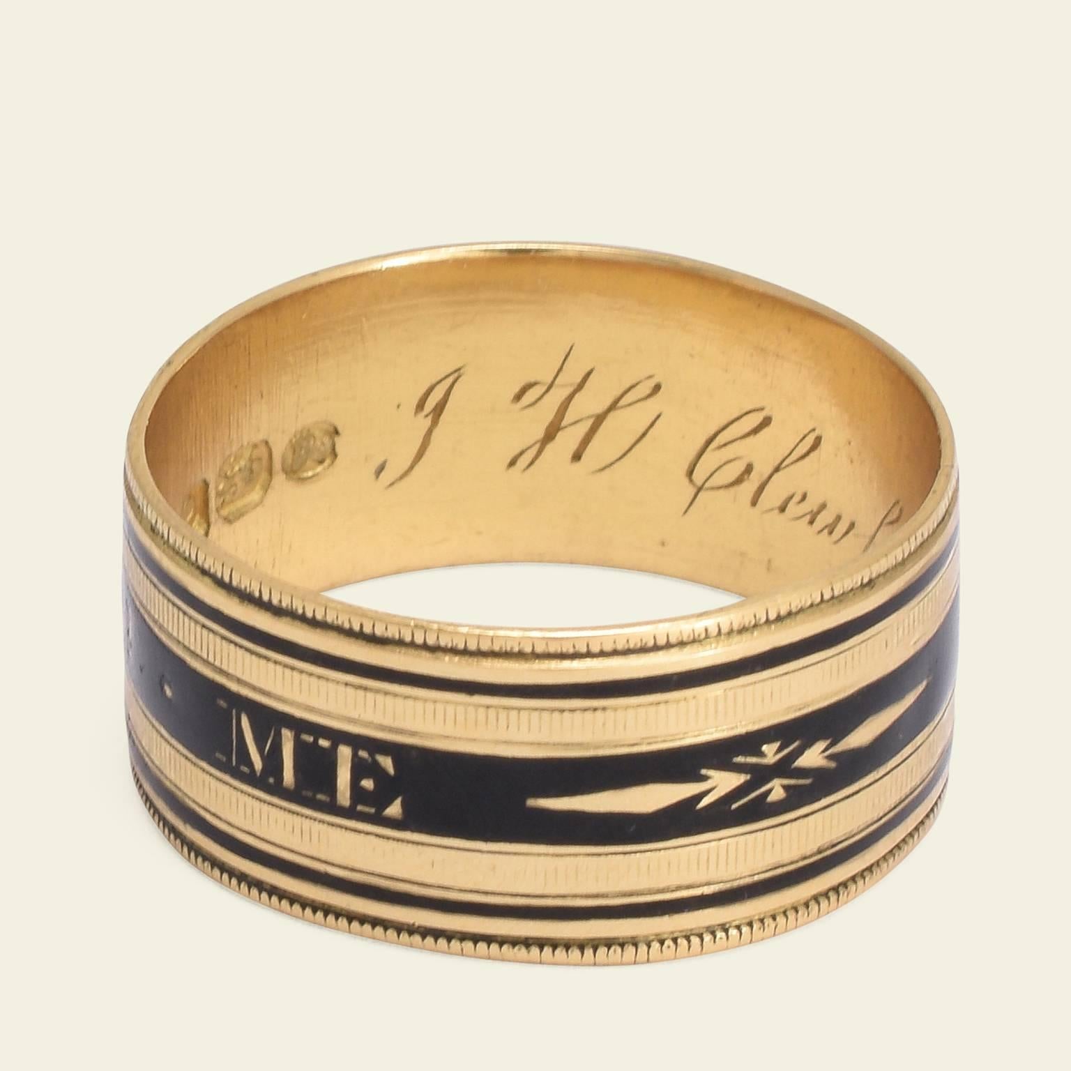 This amazing Georgian mourning band is modeled in 18k yellow gold and black enamel. Memorial rings in this style typically feature the words "In Memory Of" on the outside of the hoop, this ring, however, has the very unusual phrase