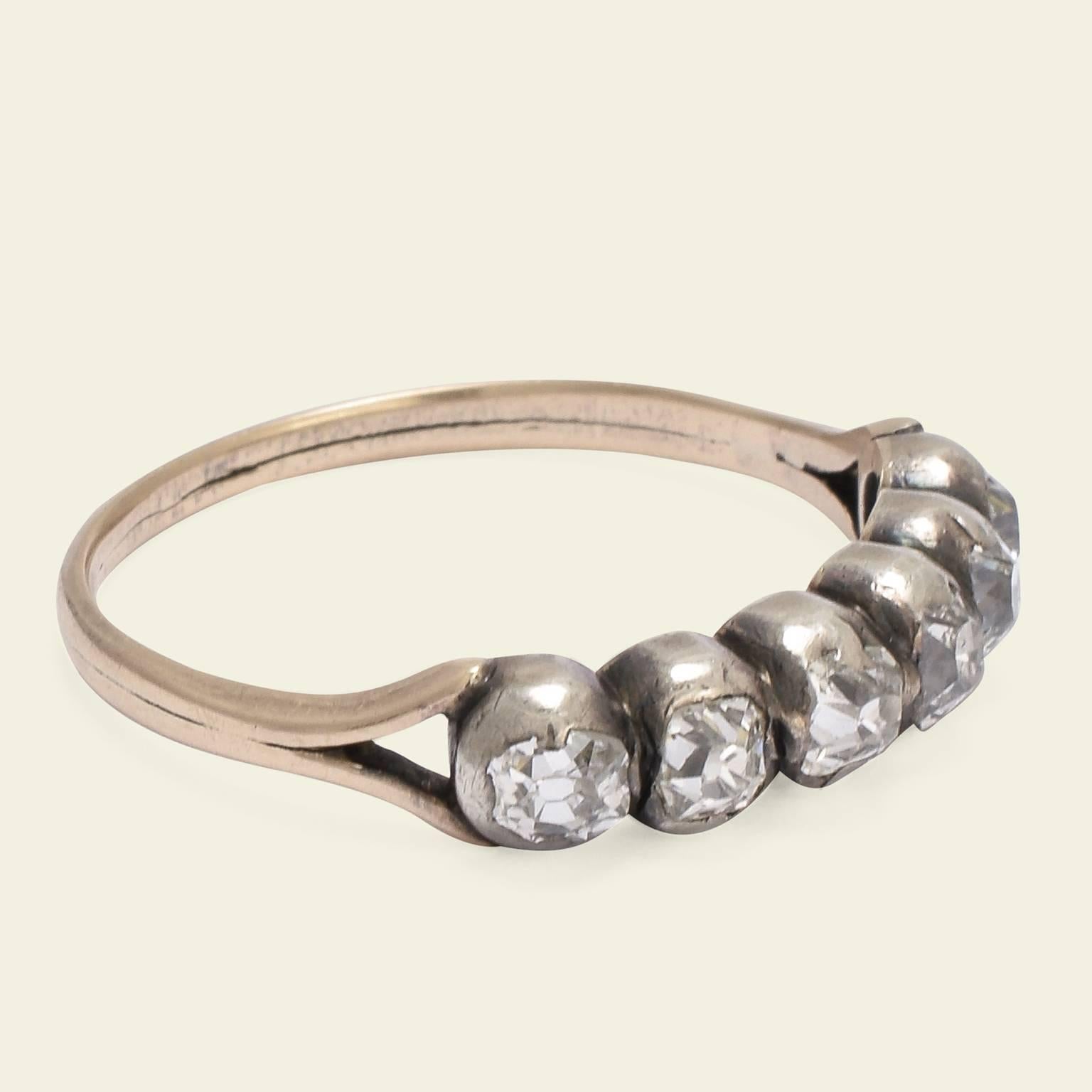 This lovely six diamond ring is a wonderful example of the simple half-hoop style popular in late Georgian Britain (the style is called a 