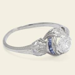Art Deco Platinum .71 Carat Diamond Engagement Ring with Calibré Cut Sapphires