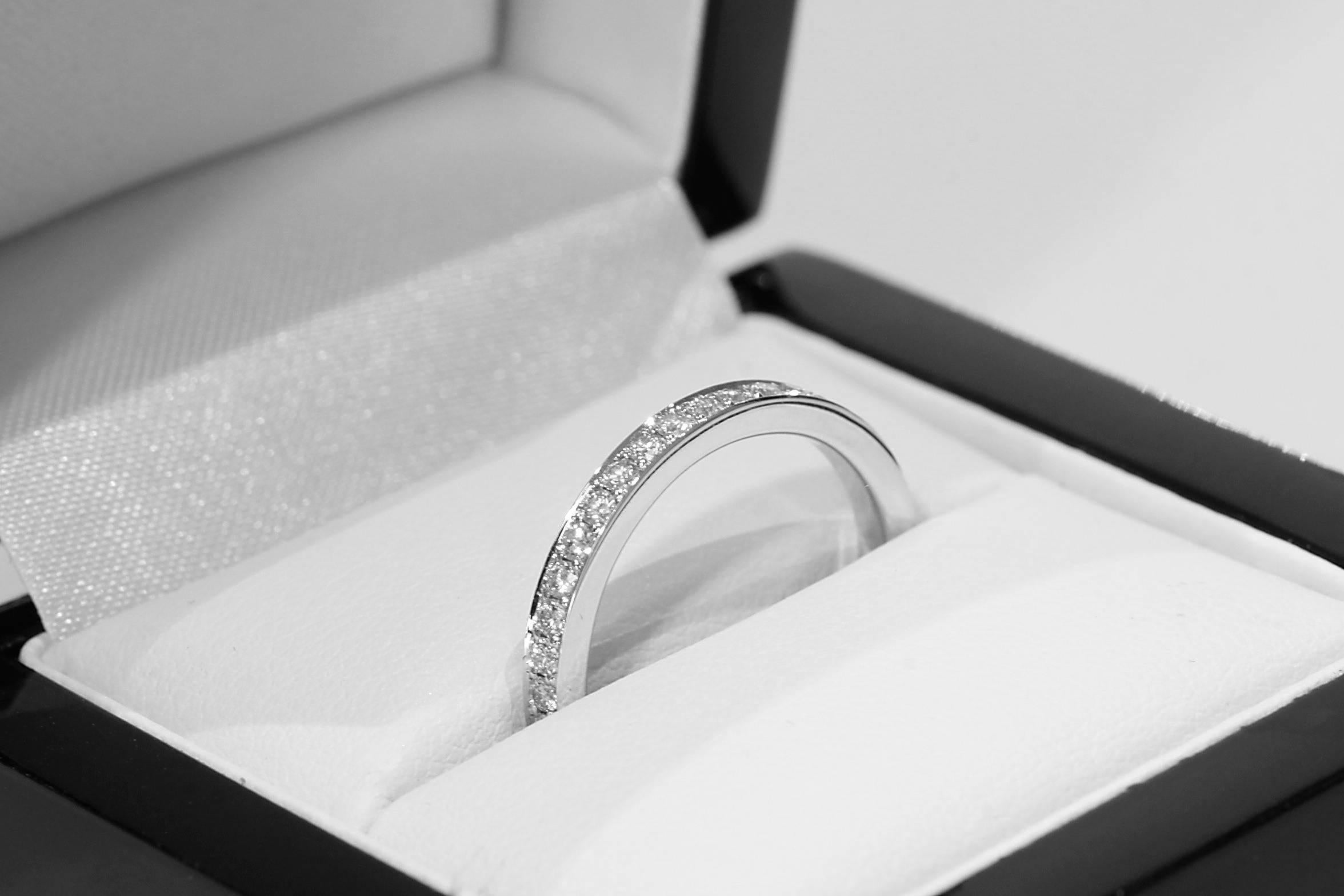 A stunning new alliance ring by Tears Undressed. This delicate 2.38 mm band is full set with white round brilliant pavé diamonds in 18 karat white gold. It contains 40 twinkling natural diamonds with a total weight of 1.20 carat. The ring is a size